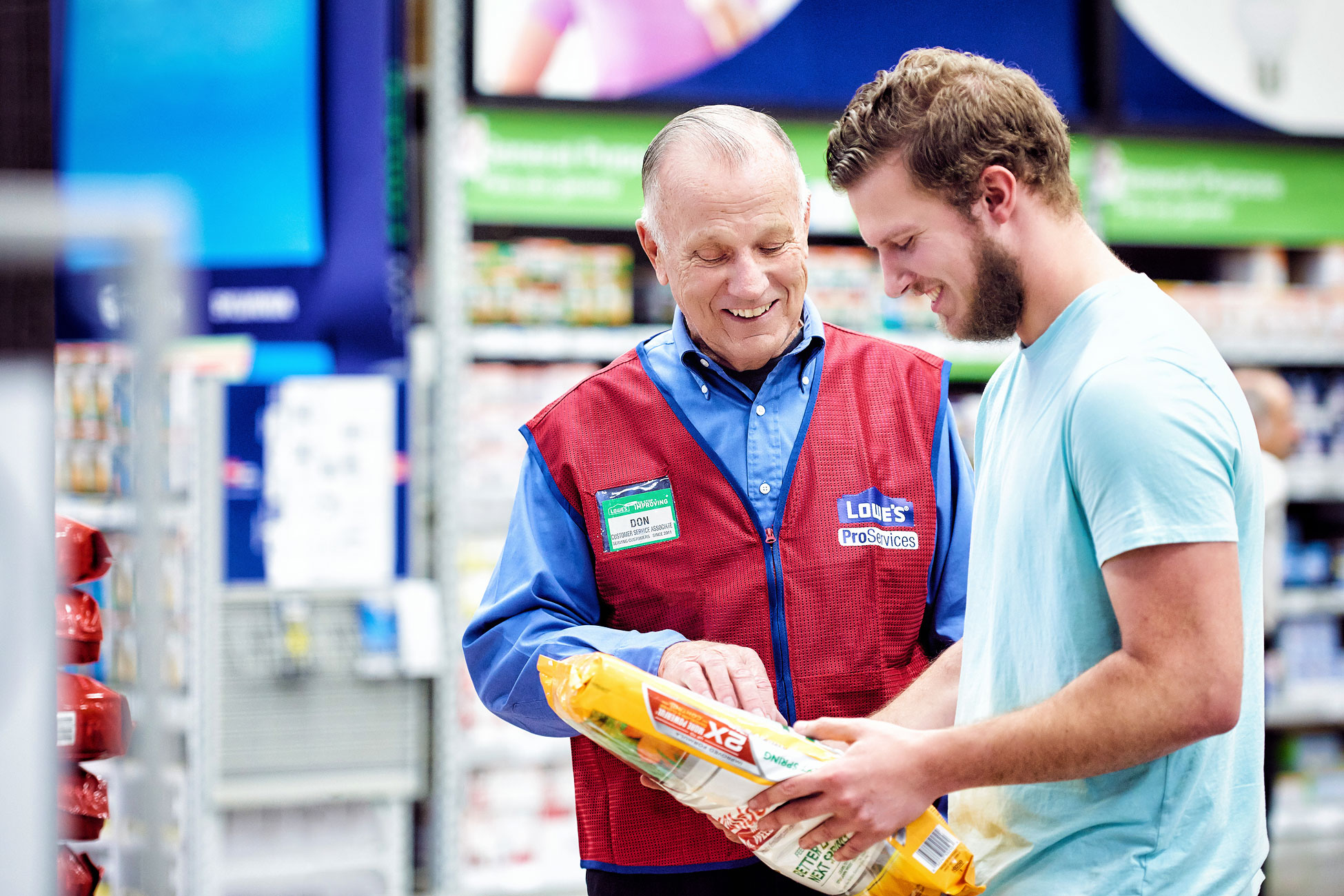 Don Collins assisting customer in Lowe