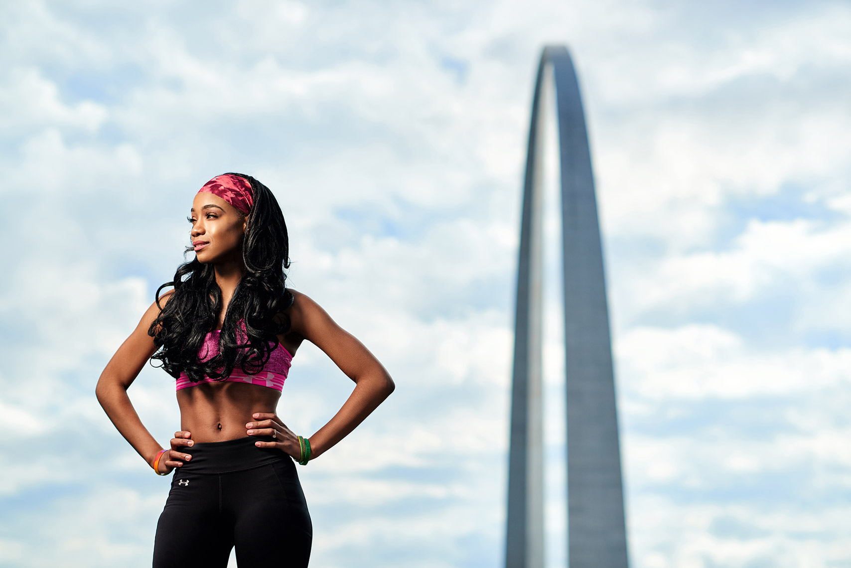 Fitness model with St. Louis Arch in background.