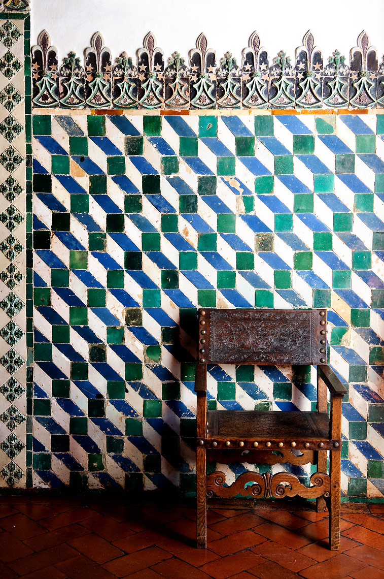 Portuguese Tiled wall with old chair.